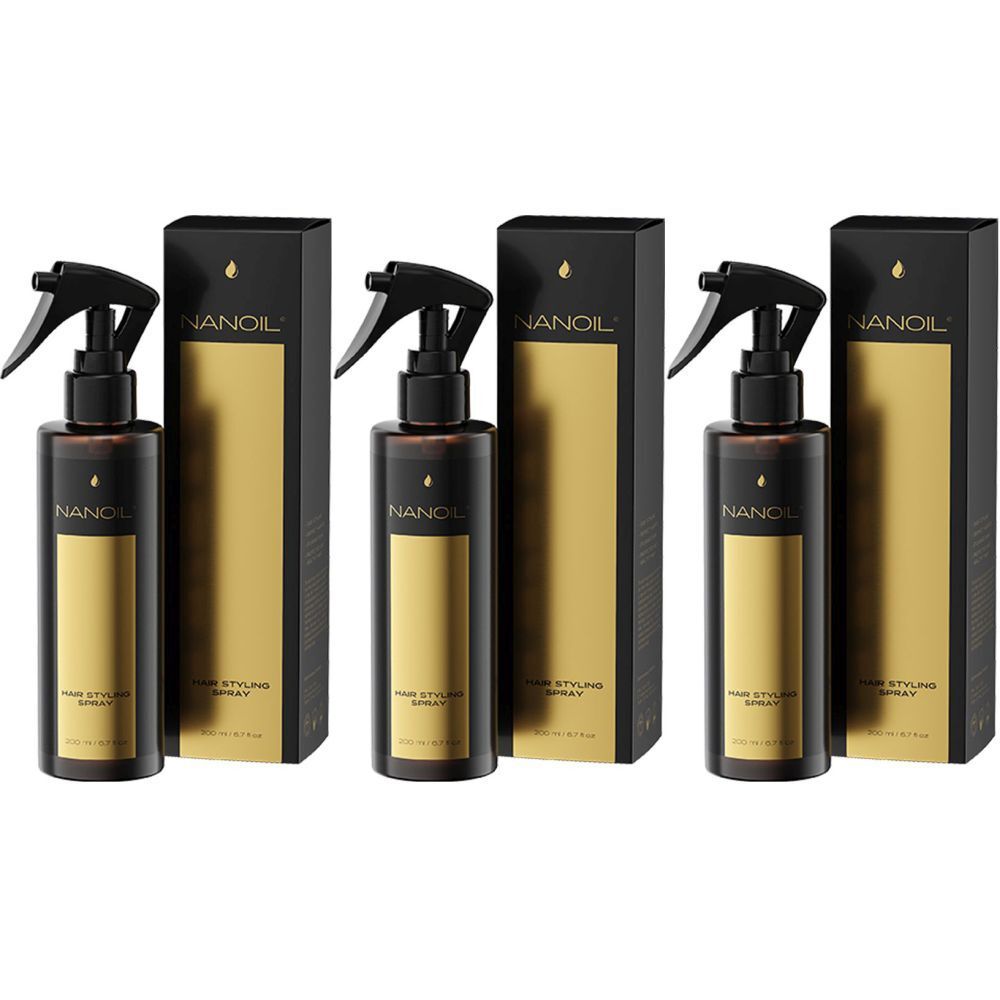 Drei Flaschen NANOIL Haarstyling-Spray mit schwarzen Sprühköpfen und Verpackungen. Goldfarbene Akzente auf den Verpackungen.