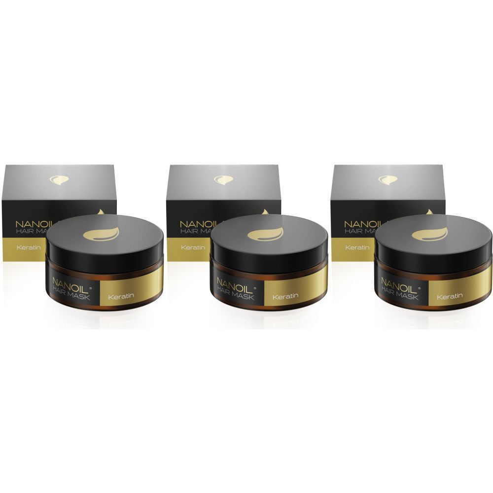 Drie potten en dozen. Op de potten staat NANOIL HAIR MASK. De deksels zijn donkerbruin met een gouden blad. De dozen zijn zwart.