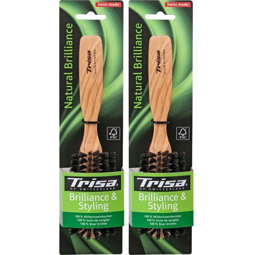 Zwei Haarbürsten in Verpackung. Holzgriff, Borsten. Aufschrift: Trisa, Natural Brilliance, Brilliance & Styling. FSC-Siegel.