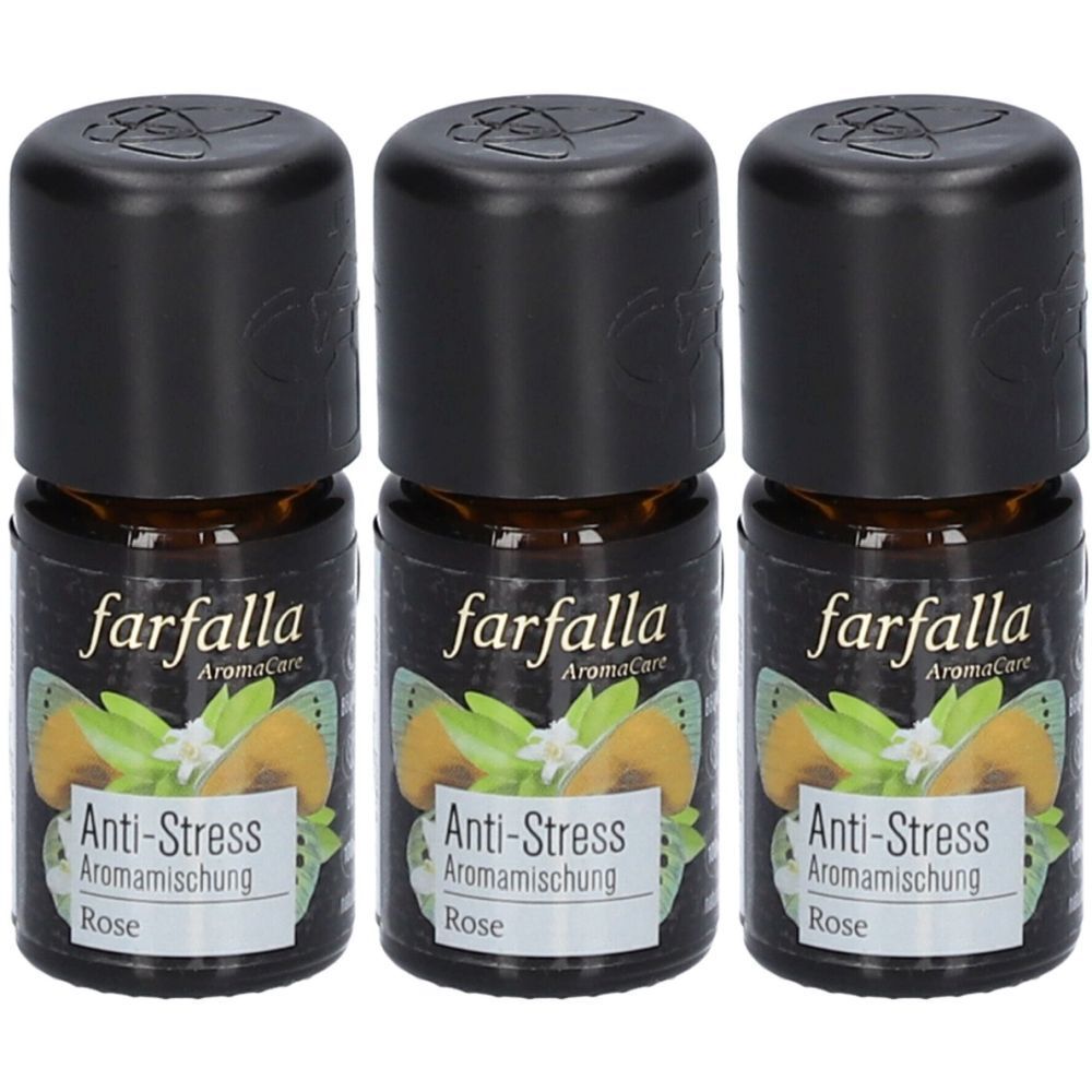Trois petites bouteilles en verre brun avec des bouchons noirs. Les étiquettes indiquent "farfalla AromaCare Anti-Stress Aromamischung Rose".