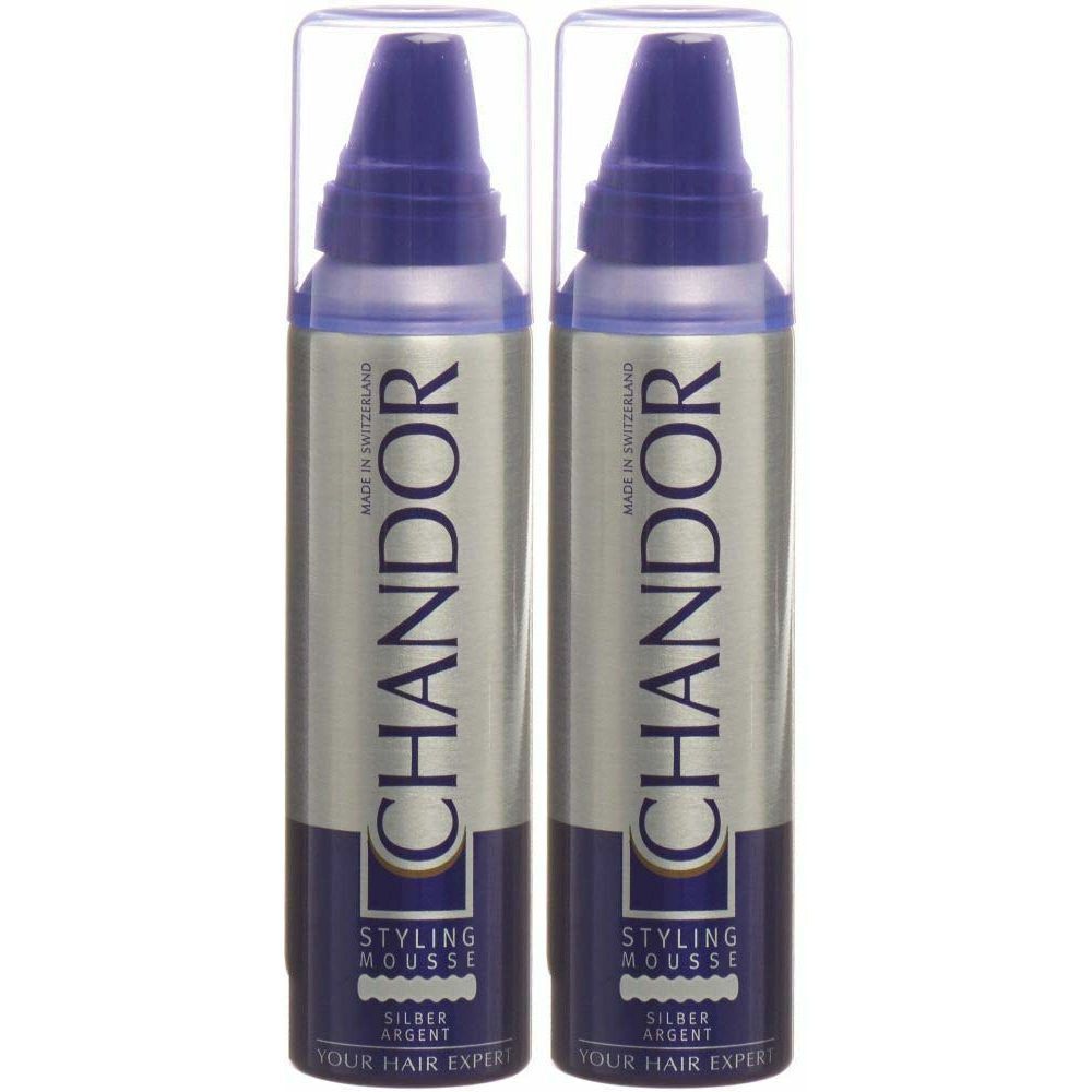 Zwei Flaschen Styling Mousse mit silberner Aufschrift. Blaue Deckel und Sprühköpfe. Aufschrift: CHANDOR, Styling Mousse Silber.