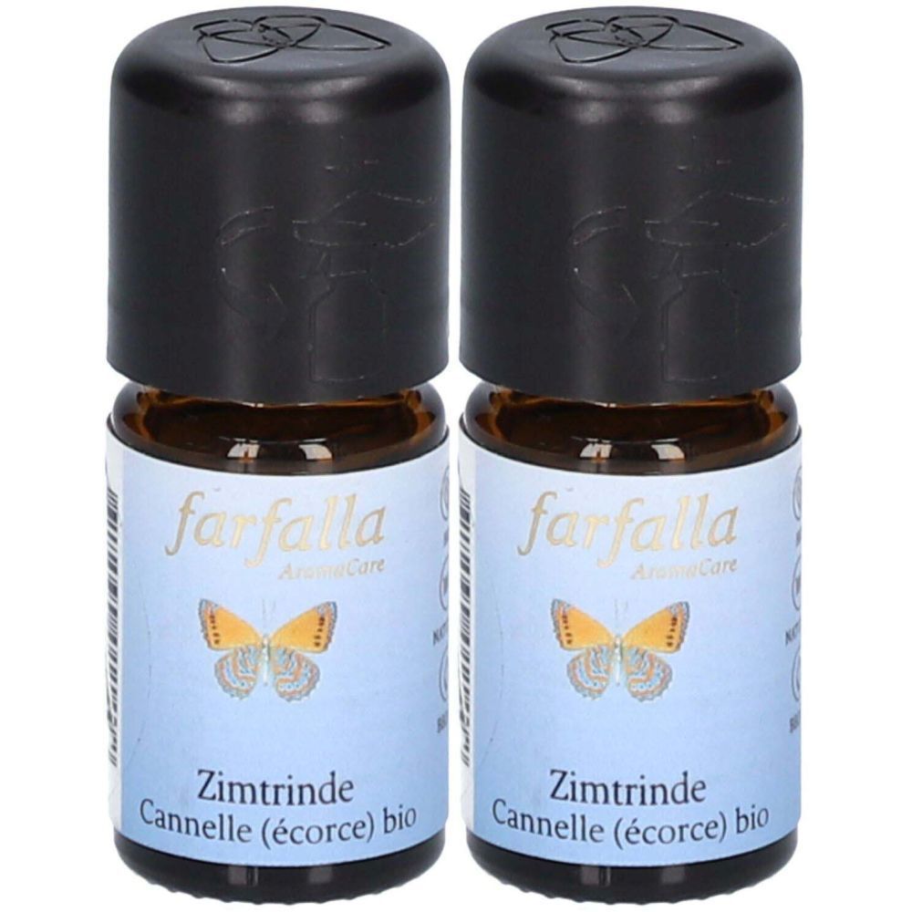 Zwei kleine braune Glasflaschen mit schwarzem Deckel. Auf den Etiketten steht "farfalla" und "Zimtrinde".