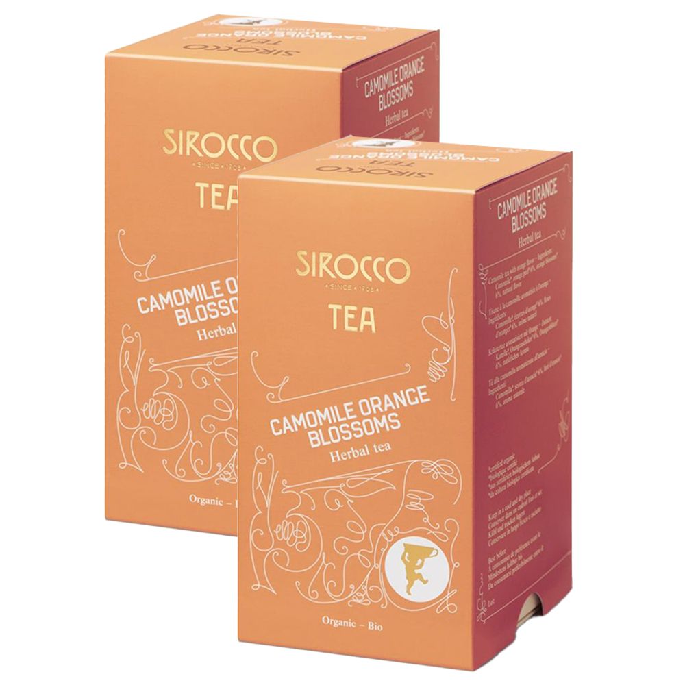 Zwei Kartons Tee. Aufschrift: SIROCCO TEA, Kamille Orangenblüten, Kräutertee. Orangefarbener Hintergrund mit weißen Verzierungen und Logo.