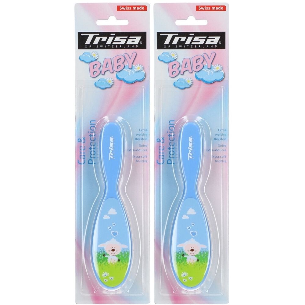 Zwei Babybürsten in Verpackung. Blaue Griffe, ovale Bürstenköpfe mit Schafmotiv. Marke Trisa, Swiss Made.