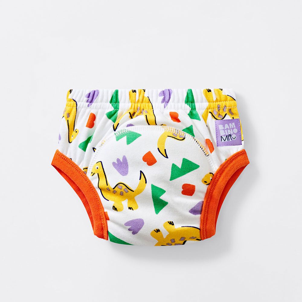 Waschbare Lernhöschen mit Dinosaurier-Motiv. Weiß mit gelben, grünen, lila und orangefarbenen Elementen. Orangefarbener Bund.