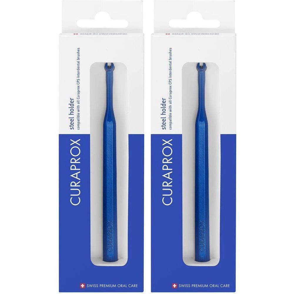 Twee blauwe CURAPROX interdentale borstelhouders in verpakking. Tekst: CURAPROX, steel holder, Swiss Premium Oral Care.