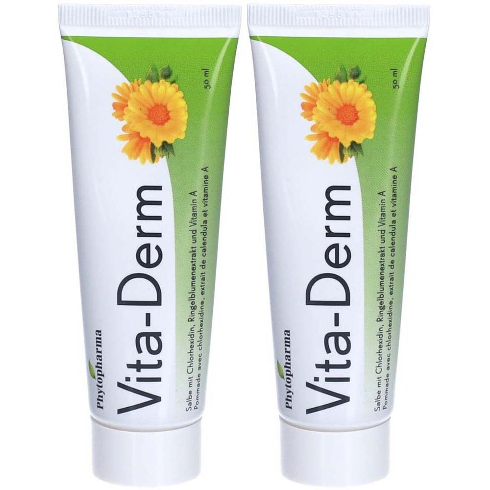 Deux tubes de crème Vita-Derm. Tubes blancs avec éléments verts et jaunes. Inscription : Vita-Derm, extrait de calendula et vitamine A. Marque : Phytopharma.