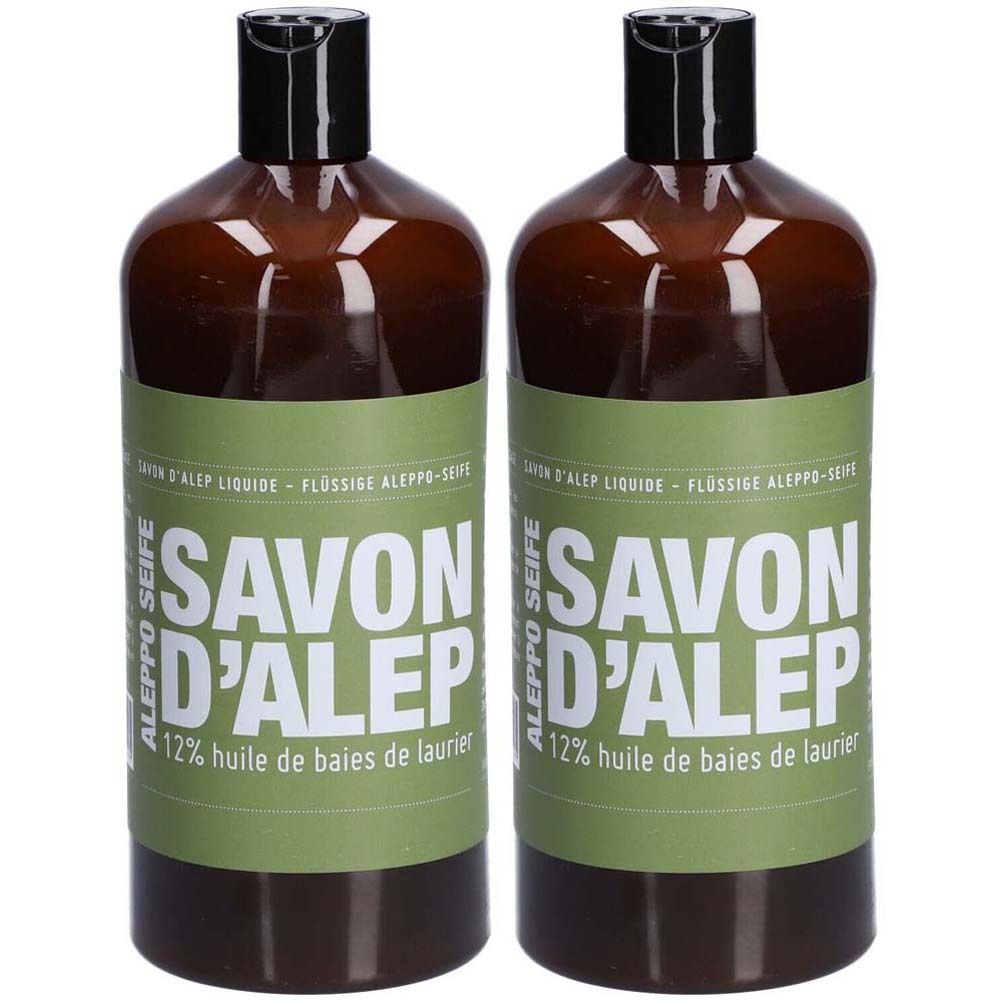 Deux flacons bruns avec bouchon noir. L'étiquette verte indique "SAVON D'ALEP" et "12% huile de baies de laurier".