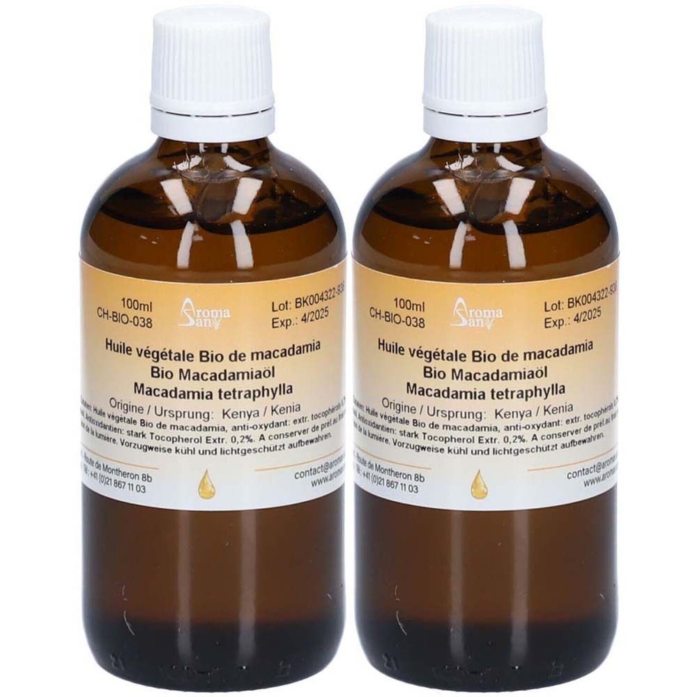 Deux flacons en verre brun avec bouchons blancs. Étiquettes avec texte: Huile végétale Bio de macadamia, Bio Macadamiaol, Macadamia tetraphylla.