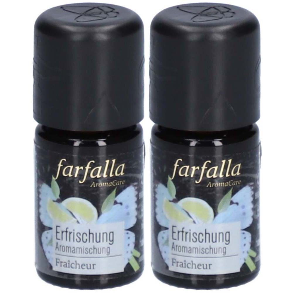Zwei kleine Flaschen mit schwarzem Deckel. Auf dem Etikett steht "farfalla" und "Erfrischung".