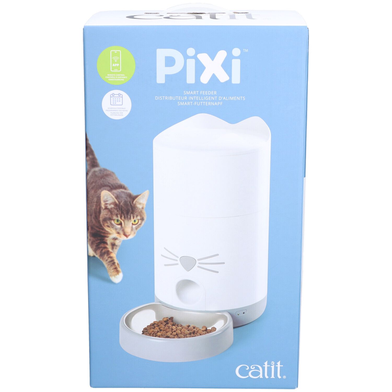 Verpackung des Catit PIXI Smart-Futterautomaten. Weißer Futterautomat mit Katzengesicht-Design, Futter in Schale. Marke Catit.