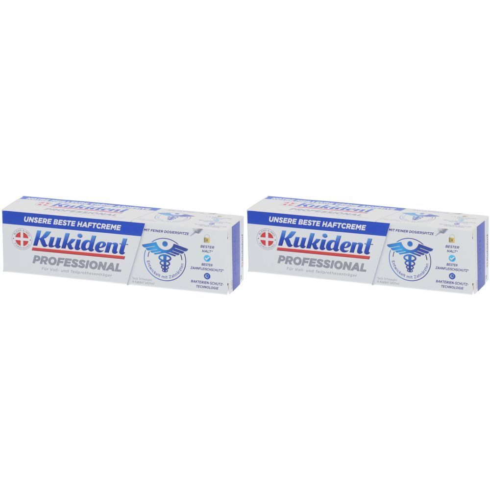 Zwei Packungen Kukident Professional Haftcreme. Weiße Schachteln mit blauen Akzenten und Logo.