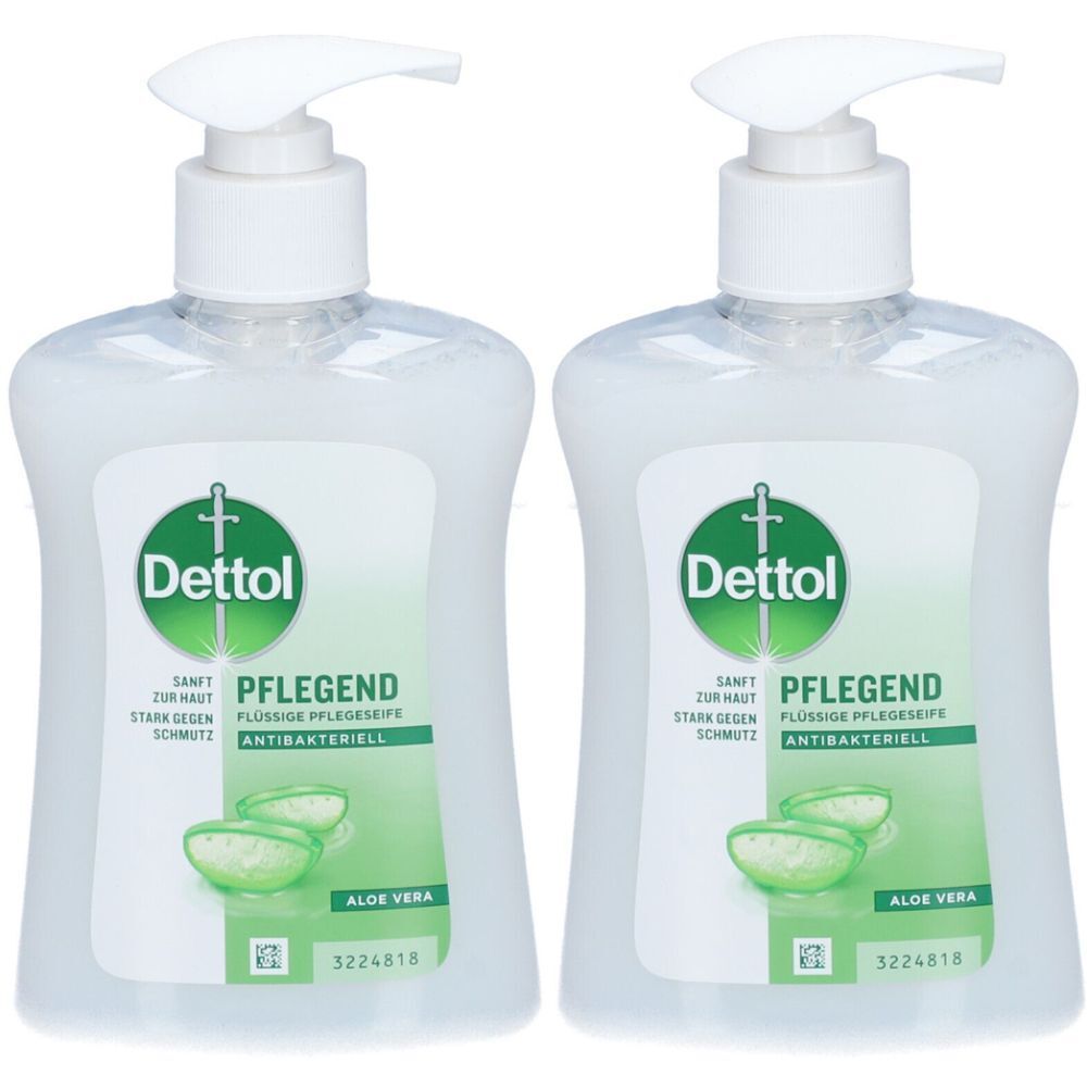 Deux distributeurs de savon liquide Dettol blancs avec pompe. Inscription : Dettol, Soin, Aloe Vera. Antibactérien.