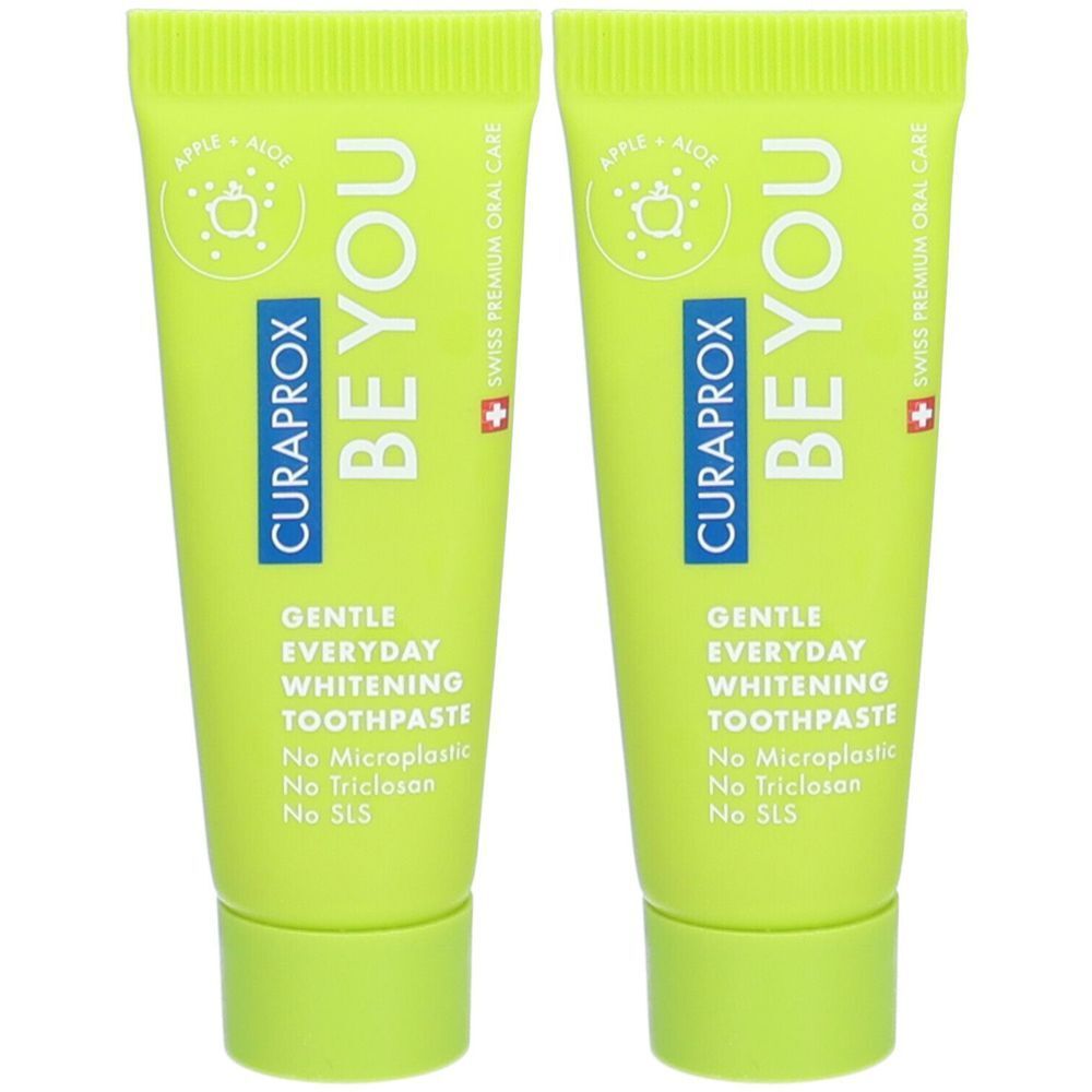 Zwei grüne Zahnpasta-Tuben. Aufschrift: CURAPROX BE YOU, GENTLE EVERYDAY WHITENING TOOTHPASTE. Schweizer Kreuz.