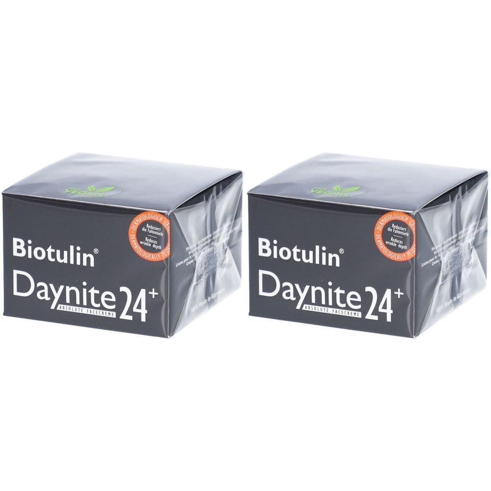 Zwei quadratische Biotulin Daynite 24+ Verpackungen. Schwarze Schachteln mit weißem Schriftzug und Logo. Siegel.