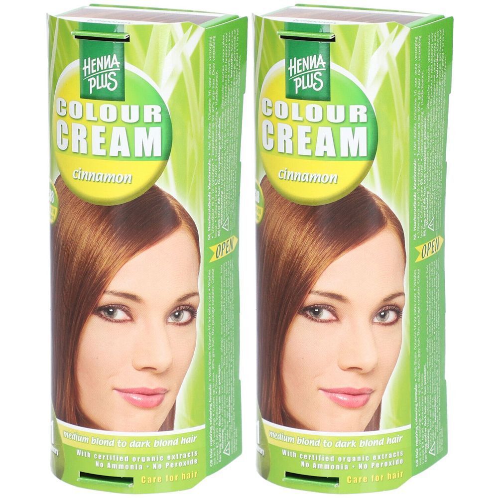 Deux boîtes de coloration capillaire. Inscription: HENNA PLUS COLOUR CREAM Cinnamon. Image d'une femme aux cheveux bruns.