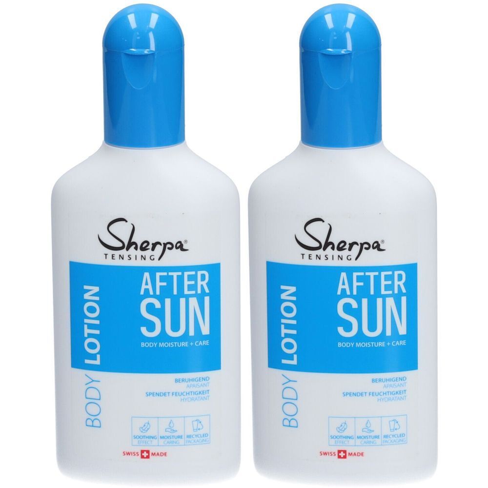 Twee flessen after-sun lotion. Witte flessen met blauwe dop. Opschrift: Sherpa Tensing, After Sun, Body Lotion.