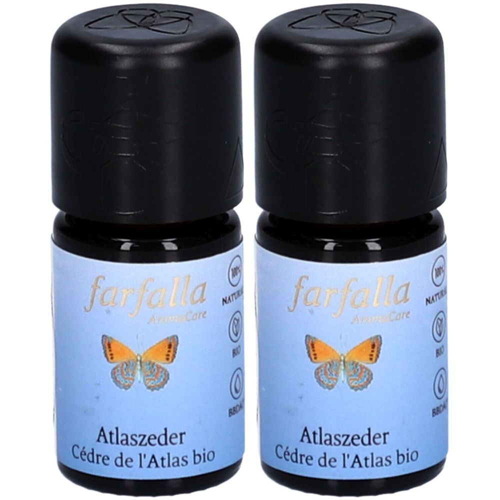 Zwei kleine Flaschen mit schwarzem Deckel. Auf dem Etikett steht "farfalla AromaCare", darunter ein Schmetterling und "Atlaszeder Cèdre de l'Atlas bio".