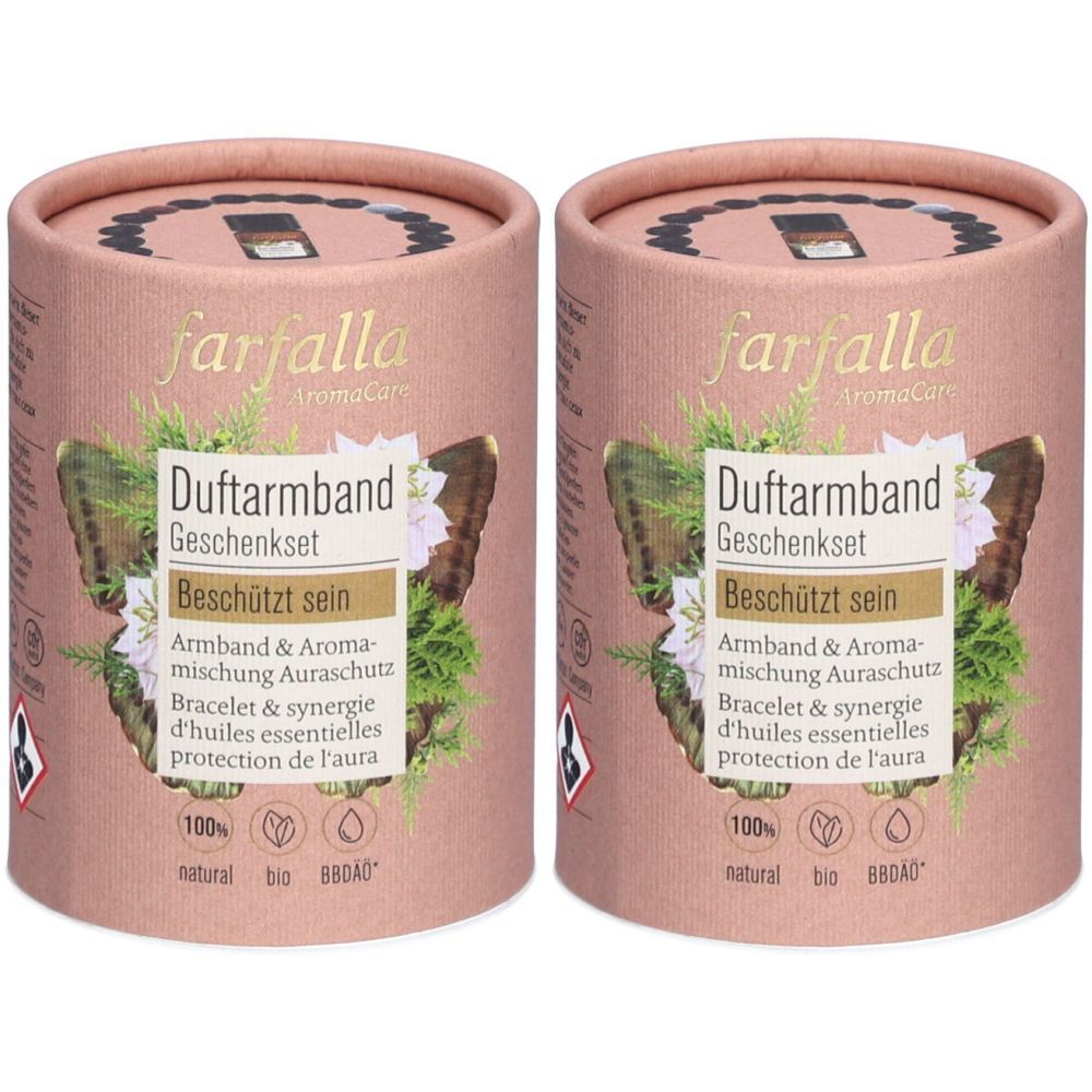 Deux coffrets cadeaux cylindriques. Inscription : Farfalla AromaCare, Duftarmband Geschenkset, Armband & Aromamischung. Certifications.