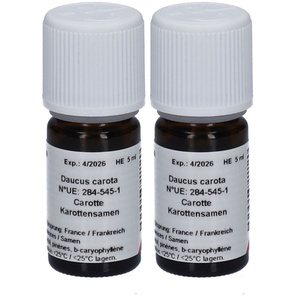 Deux flacons en verre brun avec bouchons blancs. Étiquettes avec informations : "Daucus carota", "Carotte", et date d'expiration.