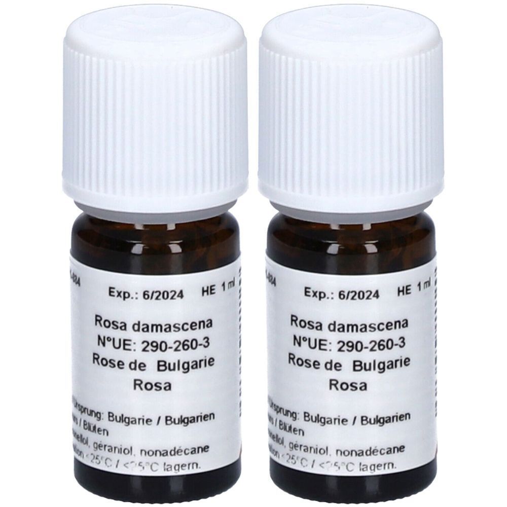 Deux petites bouteilles en verre brun avec bouchons blancs. Étiquettes avec texte : Rosa damascena, Rose de Bulgarie, Exp.: 6/2024.
