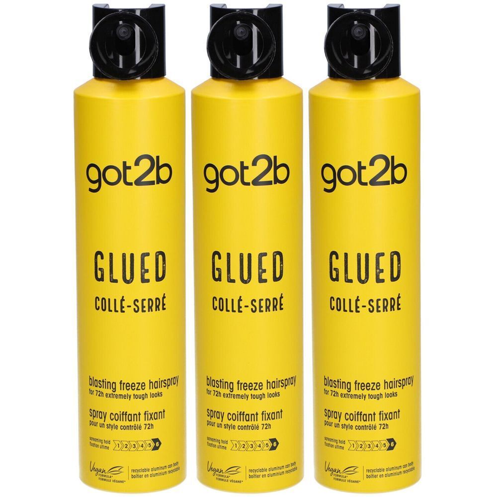 Trois sprays jaunes avec tête noire. Inscription: got2b GLUED COLLÉ-SERRÉ. Texte: Blasting freeze hairspray, spray coiffant fixant.