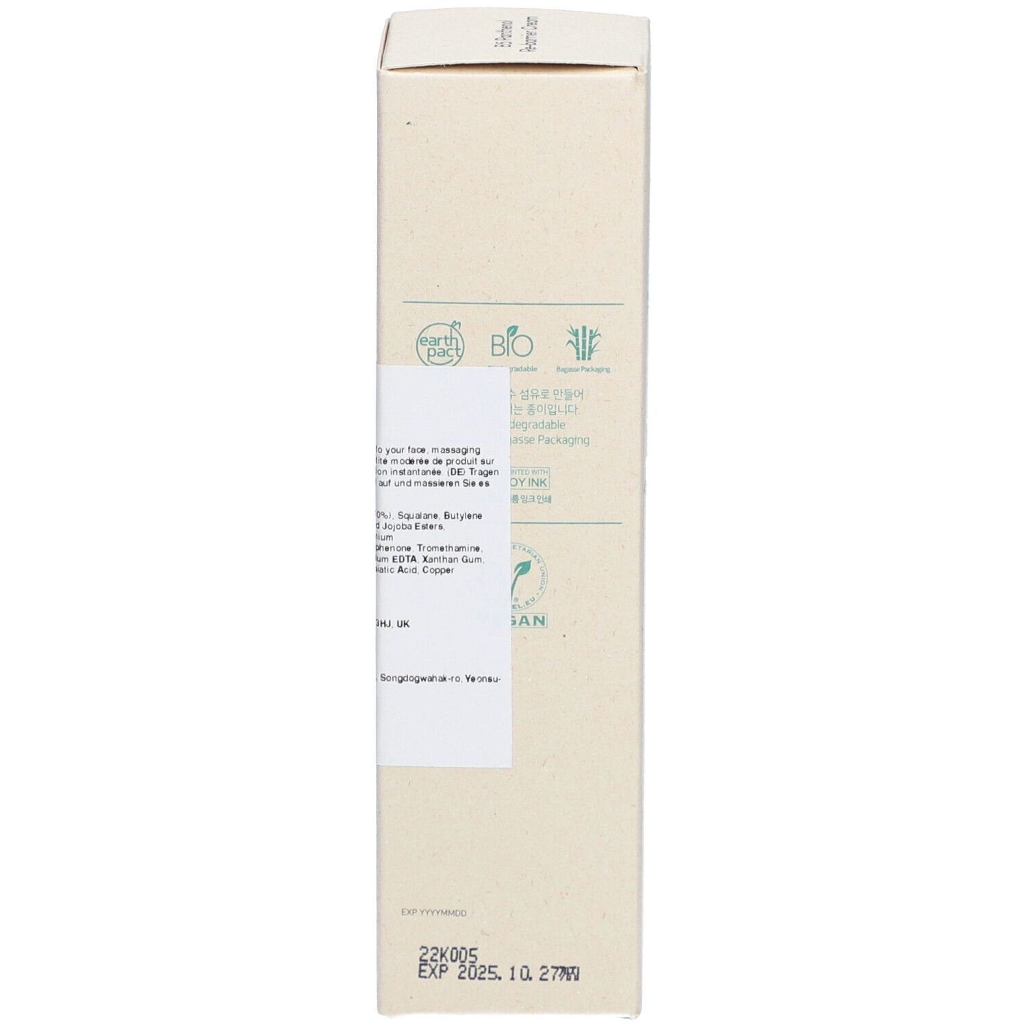 Seitenansicht der Kartonverpackung. Text über Inhaltsstoffe und Zertifizierungen. Vegan-Siegel.