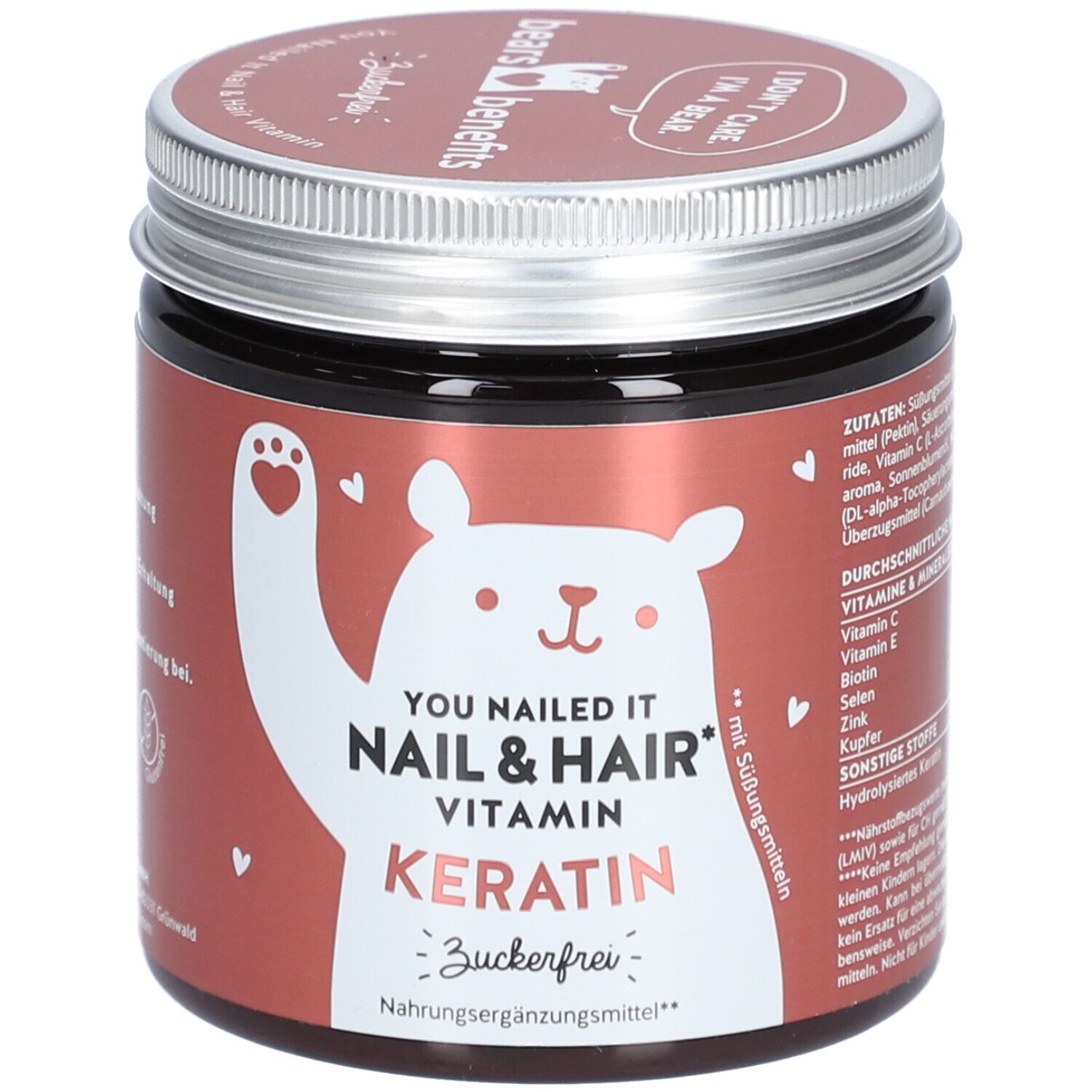 Braune Dose mit Schraubverschluss. Aufschrift: YOU NAILED IT NAIL & HAIR VITAMIN KERATIN. Zuckerfrei. Bär-Illustration.