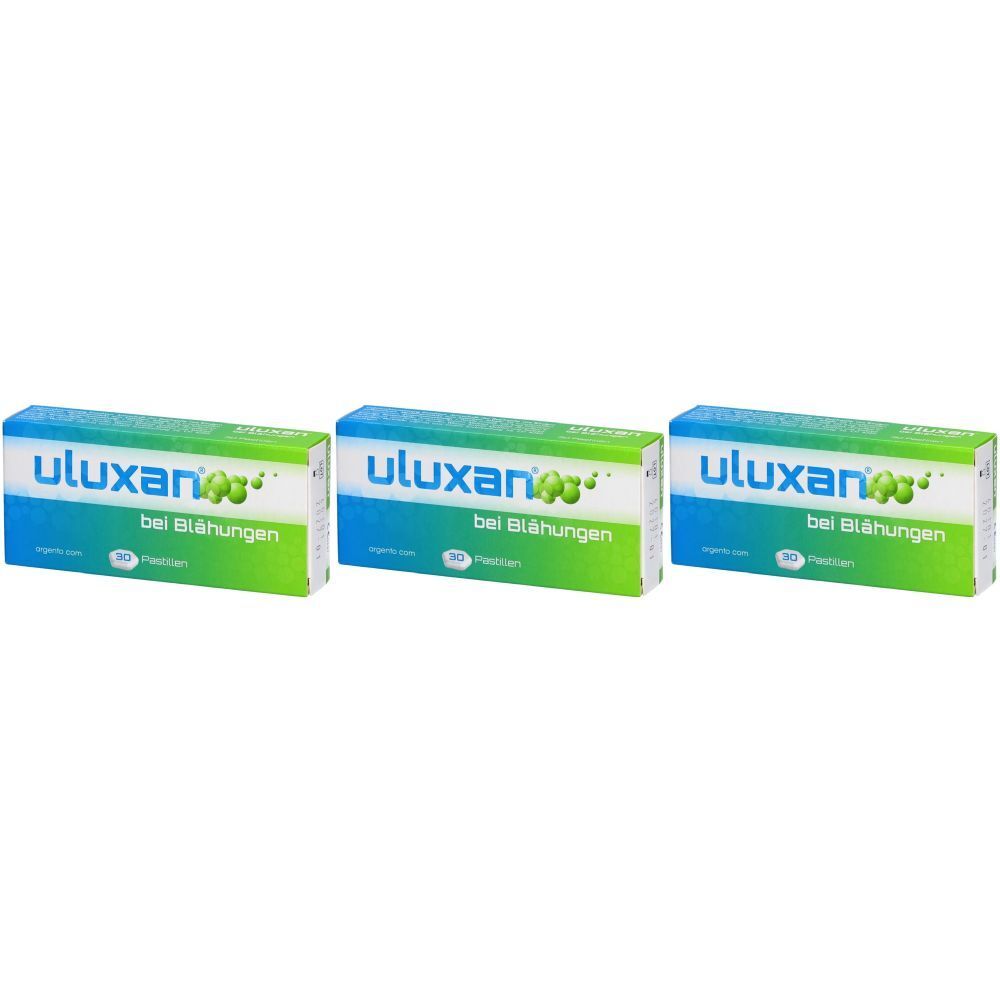 Trois boîtes de ULUXAN pastilles. Emballage bleu et vert avec texte blanc. Inscription : "bei Blähungen".