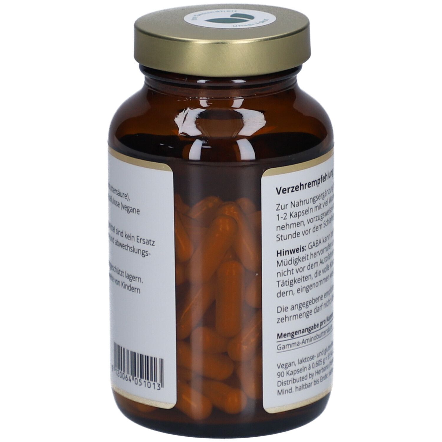 Braune Glasflasche mit Kapseln. Etikett mit Informationen. Sichtbar sind orangefarbene Kapseln.