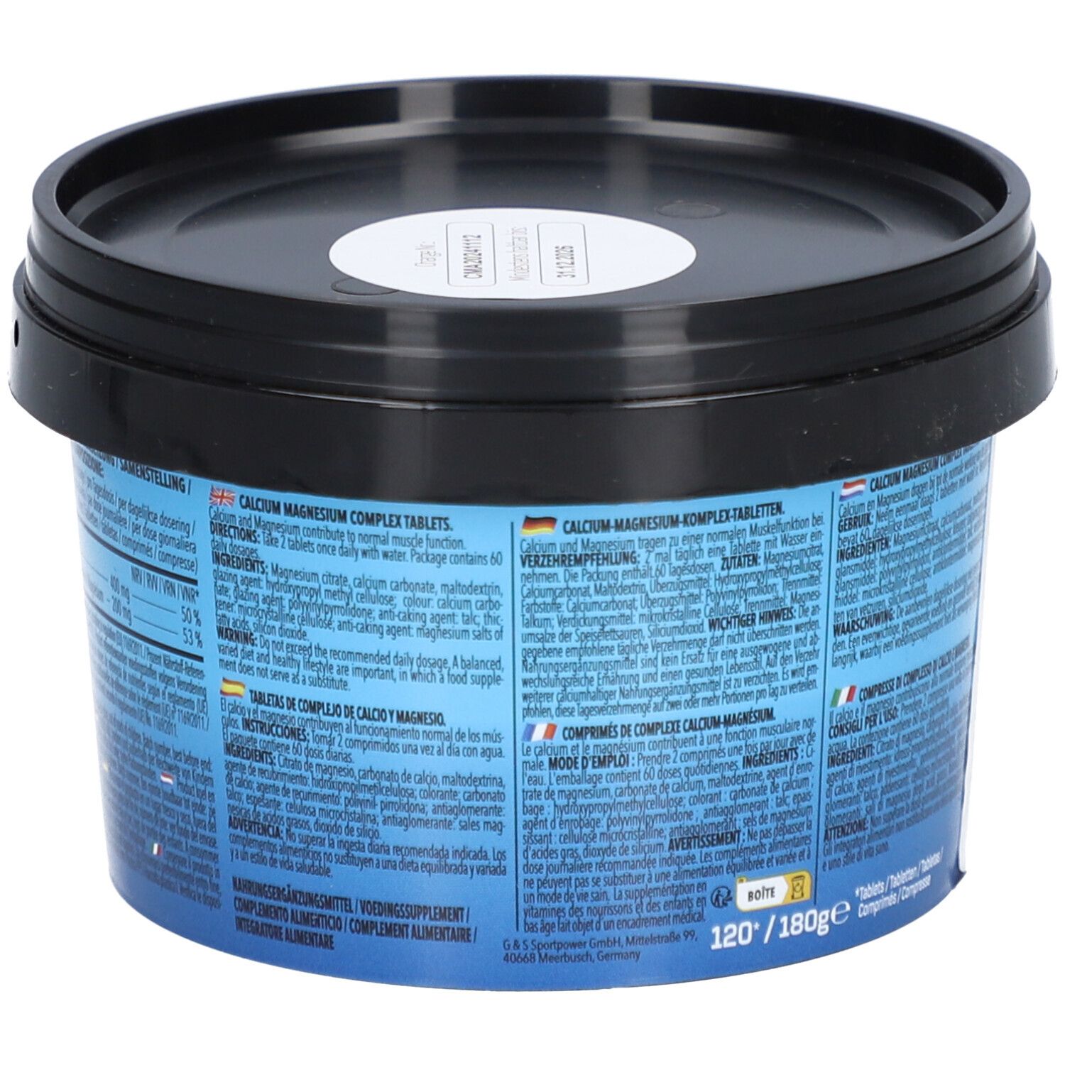 Récipient bleu avec couvercle noir. Dos avec texte en plusieurs langues. Inscription : Comprimés de complexe calcium magnésium.