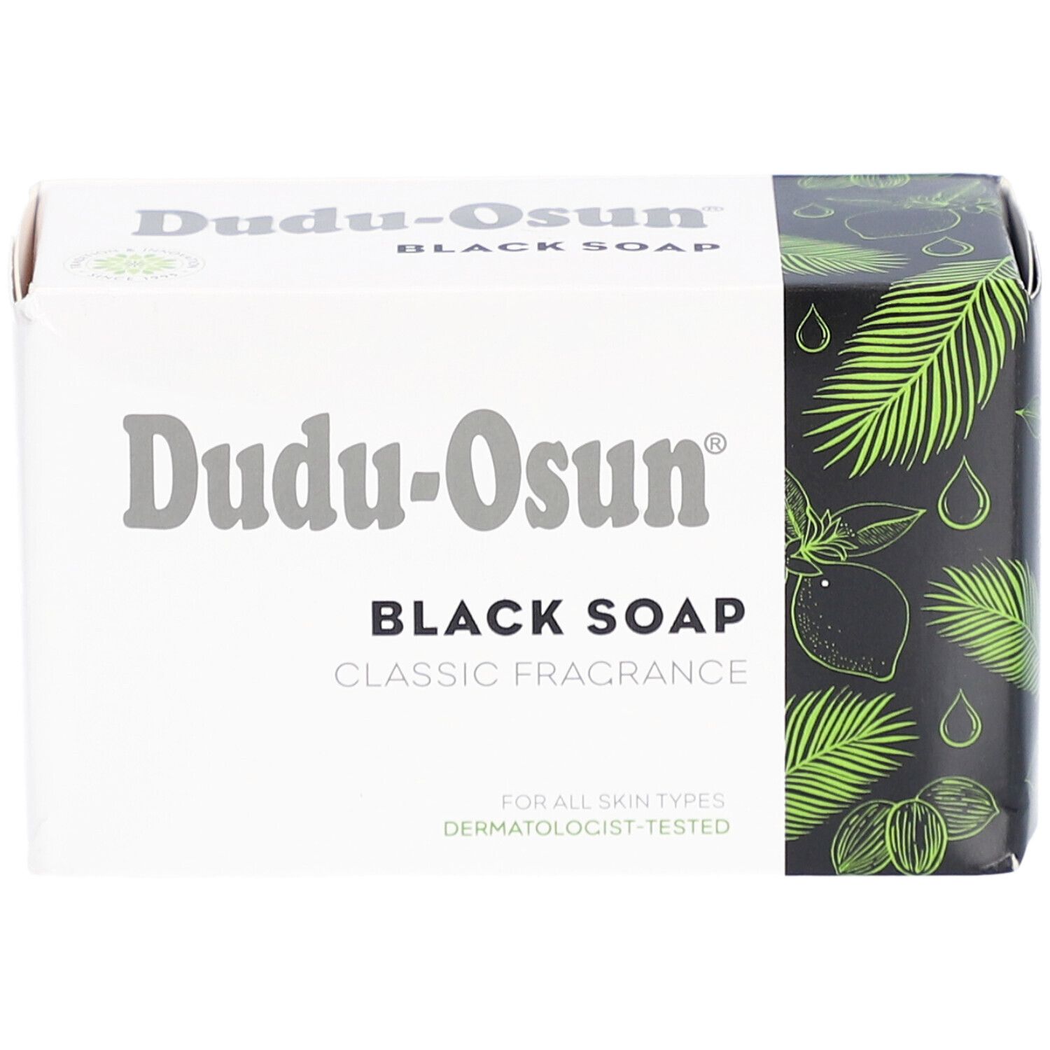 Dudu-Osun Black Soap Verpackung. Aufschrift: Black Soap, Classic Fragrance. Für alle Hauttypen. Dermatologisch getestet. Palmblatt-Design.