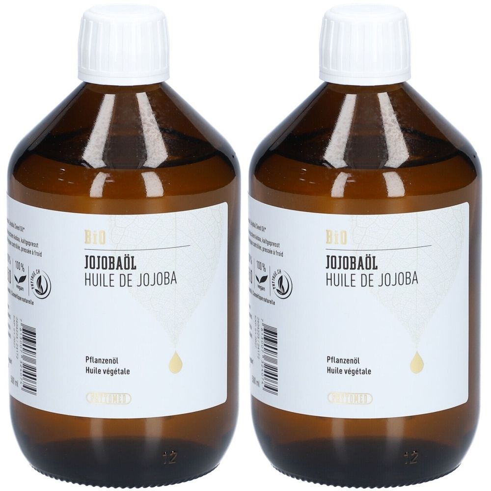 Deux flacons en verre brun avec des bouchons blancs. Les étiquettes indiquent "BIO JOJOBAÖL" et "HUILE DE JOJOBA".