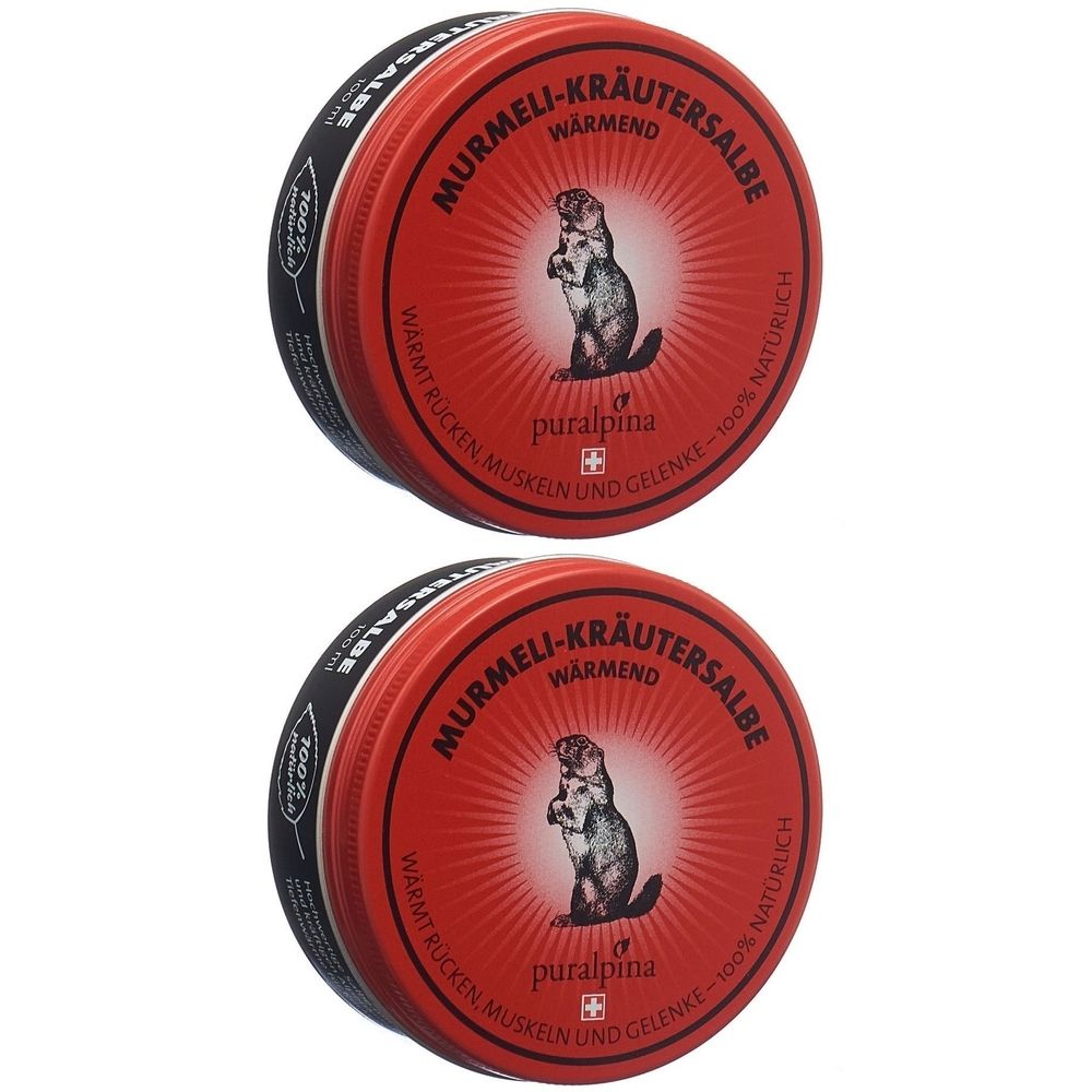 Deux boîtes rondes rouges. Inscription: Murmeli-Kräutersalbe wärmend. Logo: marmotte. Marque: puralpina. Bord noir avec texte.