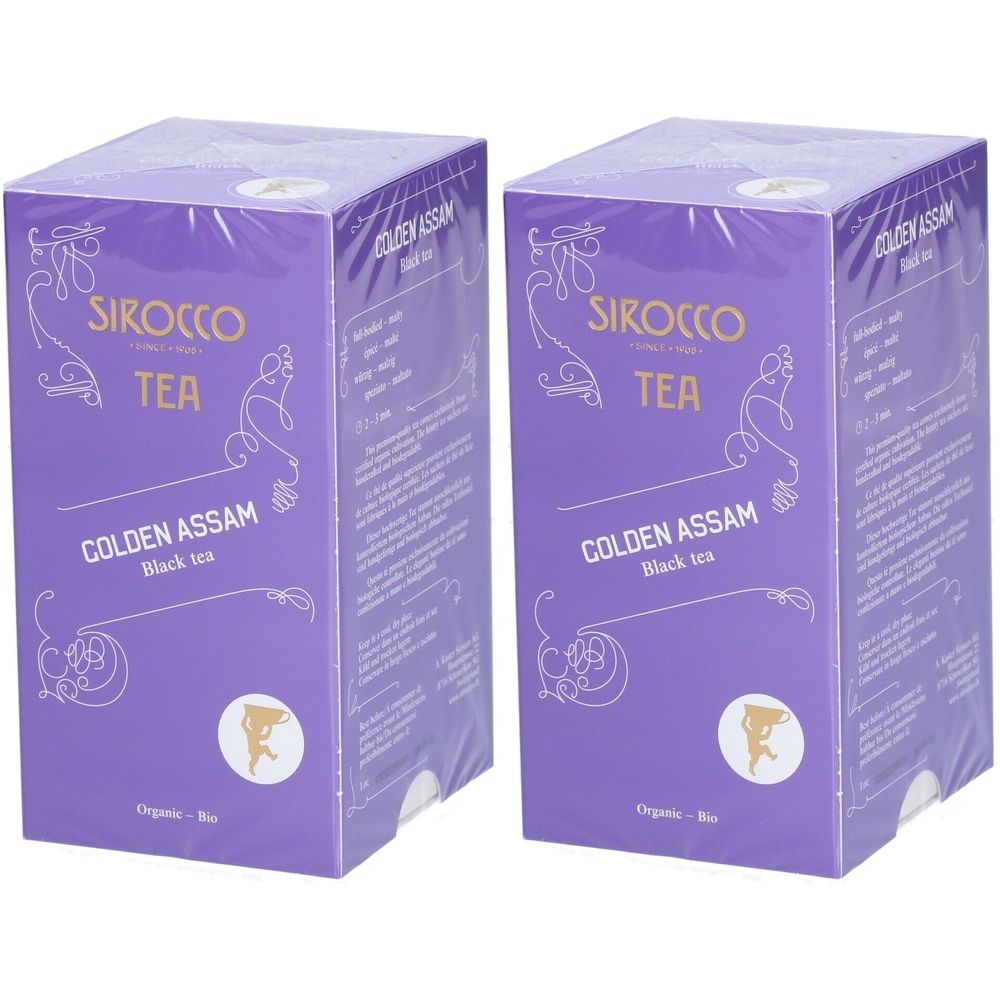 Zwei lilafarbene Kartons mit Aufschrift "SIROCCO TEA GOLDEN ASSAM Black tea". Organisch.