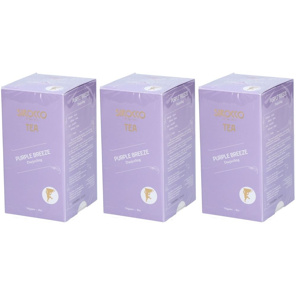 Drei lilafarbene Kartons mit der Aufschrift "SIROCCO TEA PURPLE BREEZE". Goldfarbene Schrift. Runde Siegel.
