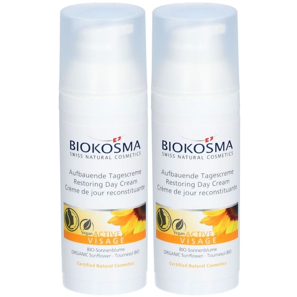 Deux crèmes blanches avec couvercles transparents. Inscription: BIOKOSMA, Aufbauende Tagescreme, Restoring Day Cream, Vegan, Active Visage, tournesol.