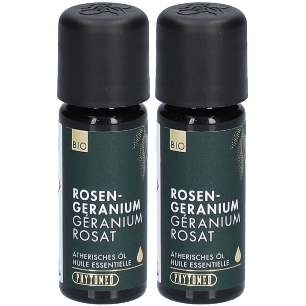 Zwei Flaschen ätherisches Öl. Schwarze Kappen, grüne Etiketten mit Text: Rosen-Geranium, BIO-Siegel, PHYTOMED.