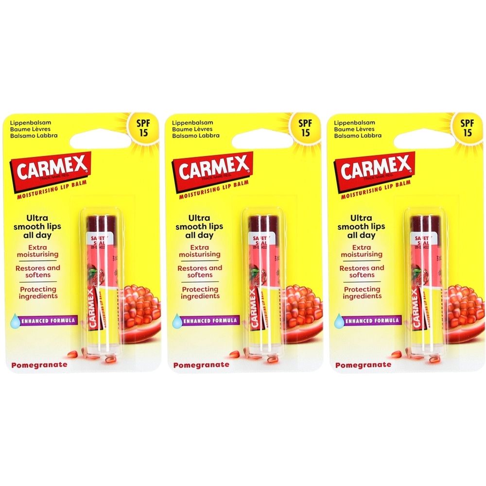 Drei Lippenbalsam-Verpackungen. Gelbe Karte mit CARMEX-Logo, Lippenbalsam-Stift und Granatapfel-Abbildung. Text: SPF 15, Ultra smooth lips all day.