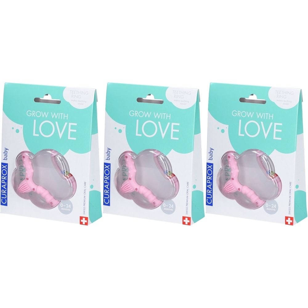 Drei Verpackungen mit rosa Beißringen. Aufschrift: GROW WITH LOVE, CURAPROX baby. Schweizer Kreuz.