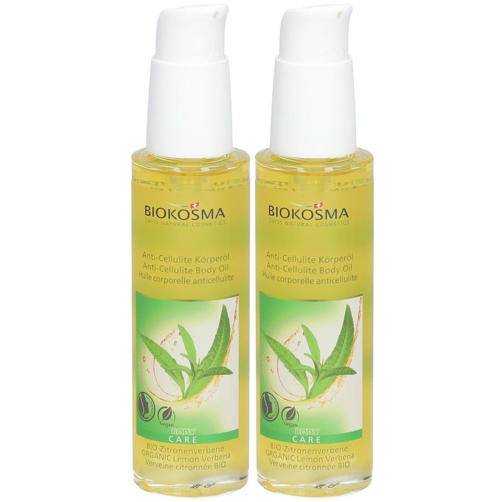 Deux flacons d'huile corporelle avec bouchon pompe blanc. Inscription BIOKOSMA. Étiquette verte et jaune avec feuilles et texte. Huile corporelle anti-cellulite.