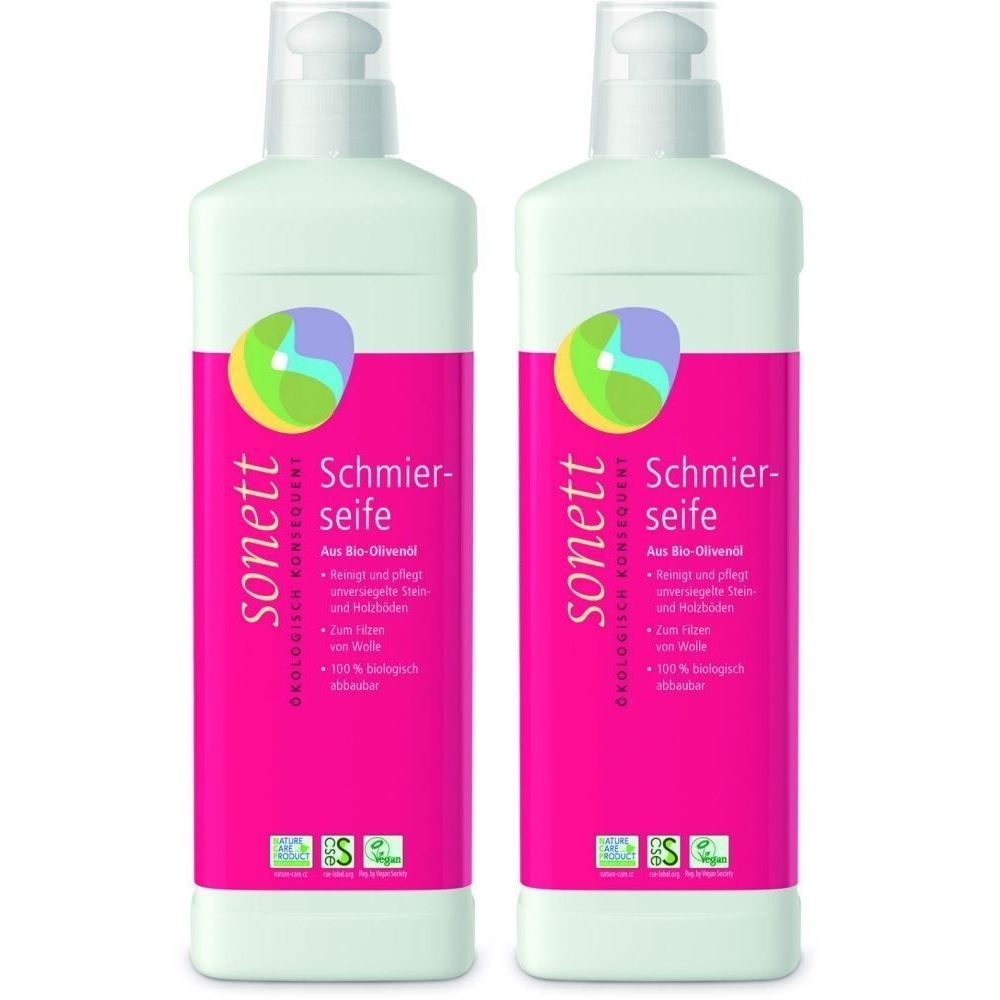 Zwei Flaschen Sonett Schmierseife. Weiße Flaschen mit rosa Etikett. Logo und Produktbezeichnung sind sichtbar.