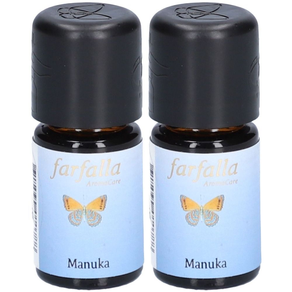 Deux petites bouteilles avec des bouchons noirs. Les étiquettes indiquent "farfalla Aromacare" et "Manuka". Un papillon est représenté.