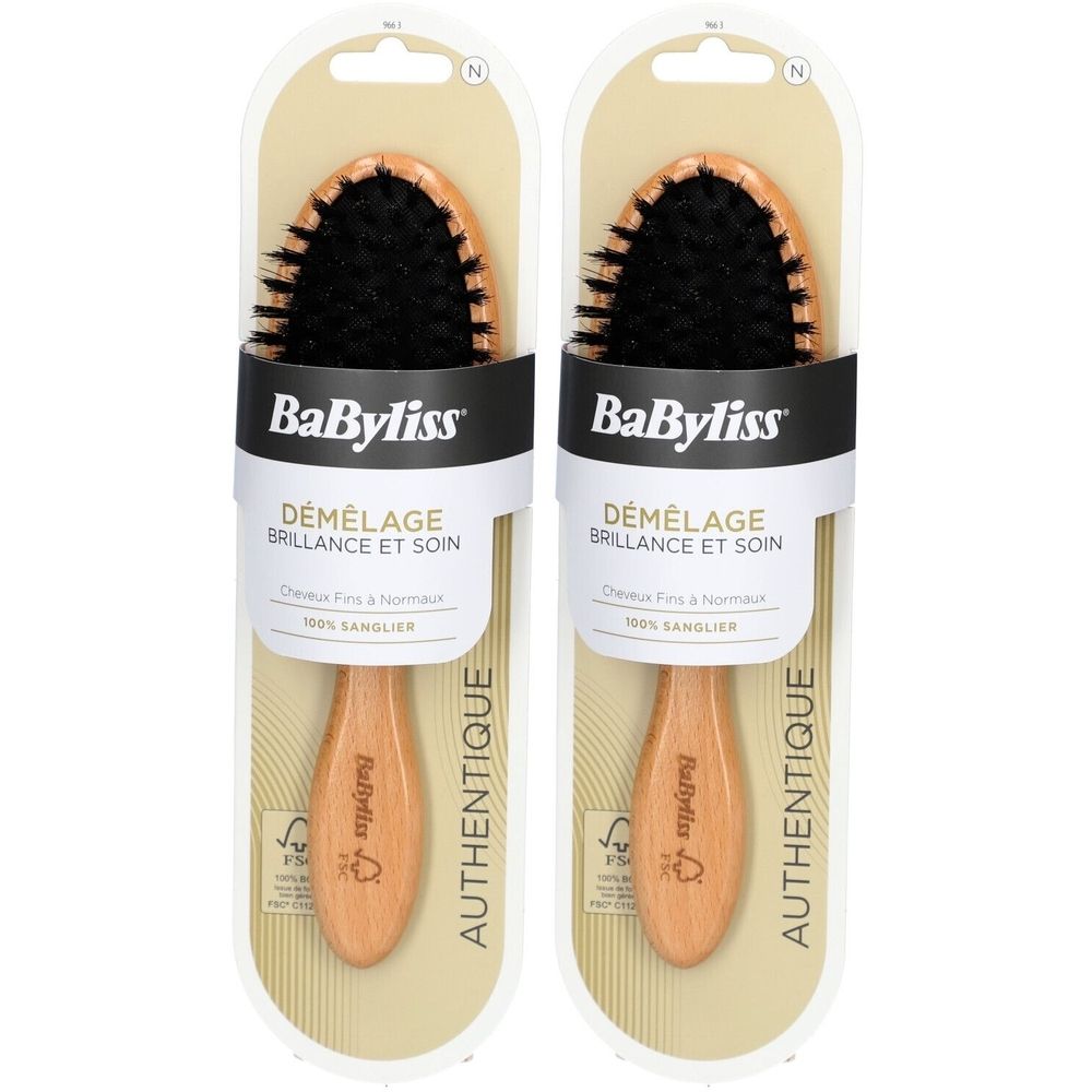 Zwei BaByliss-Holzbürsten in Verpackung. Ovaler Bürstenkopf mit schwarzen Borsten. Holzgriff mit Logo und FSC-Siegel.