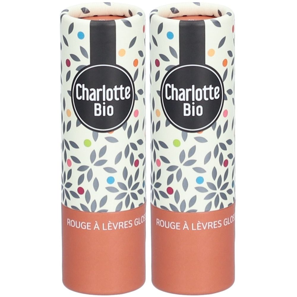 Zwei zylindrische Verpackungen. Aufschrift "Charlotte Bio". Unterteil braun, Rest mit floralem Muster und Punkten.