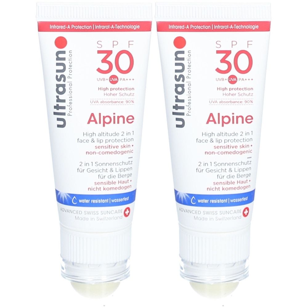 Zwei Tuben Sonnenschutzmittel. Weiß, mit roter und blauer Schrift. Aufschrift: SPF 30, Alpine, wasserresistent.