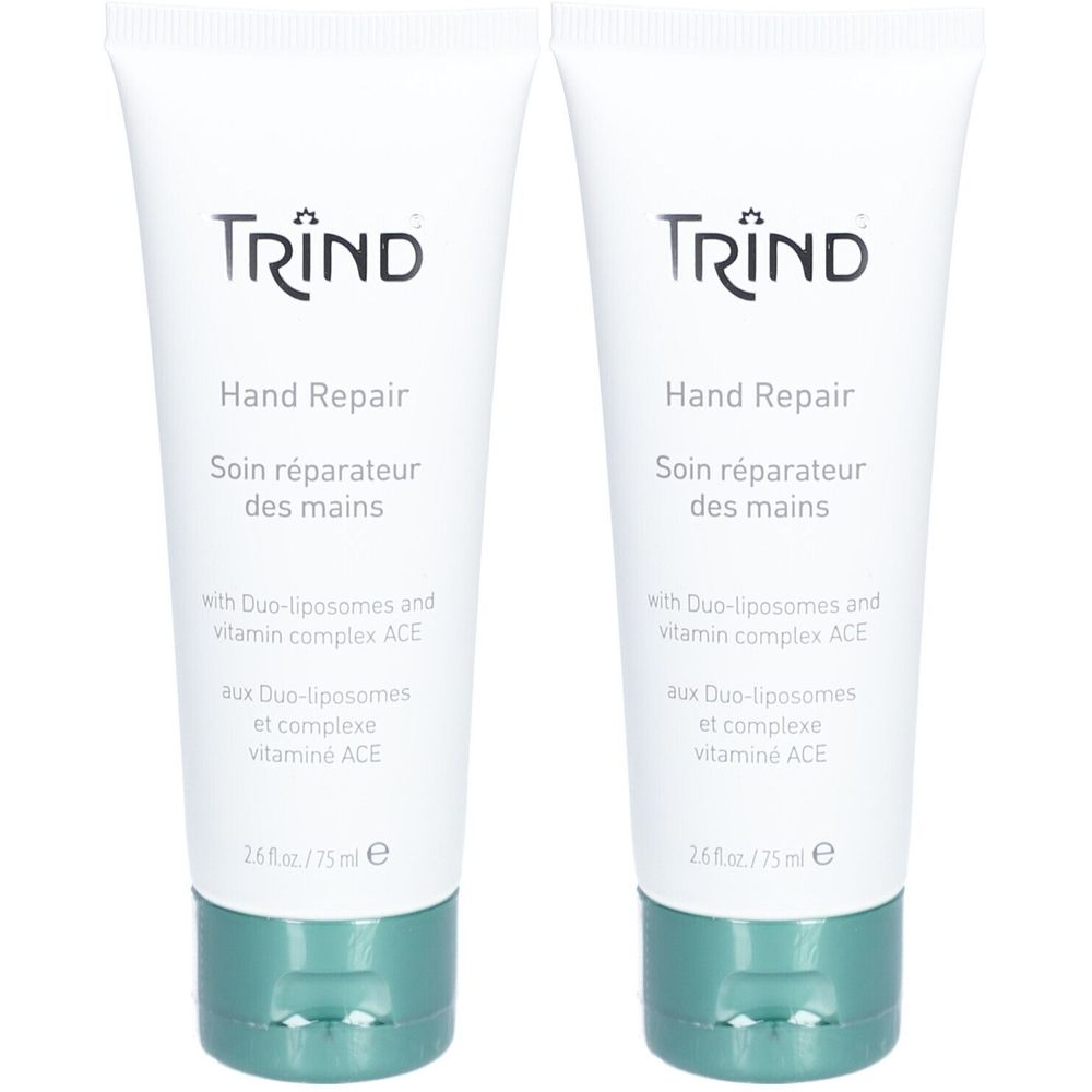 Zwei Tuben Hand Repair Creme. Weiße Tuben mit grünem Verschluss. Aufschrift: TRIND, Hand Repair, Soin réparateur des mains.