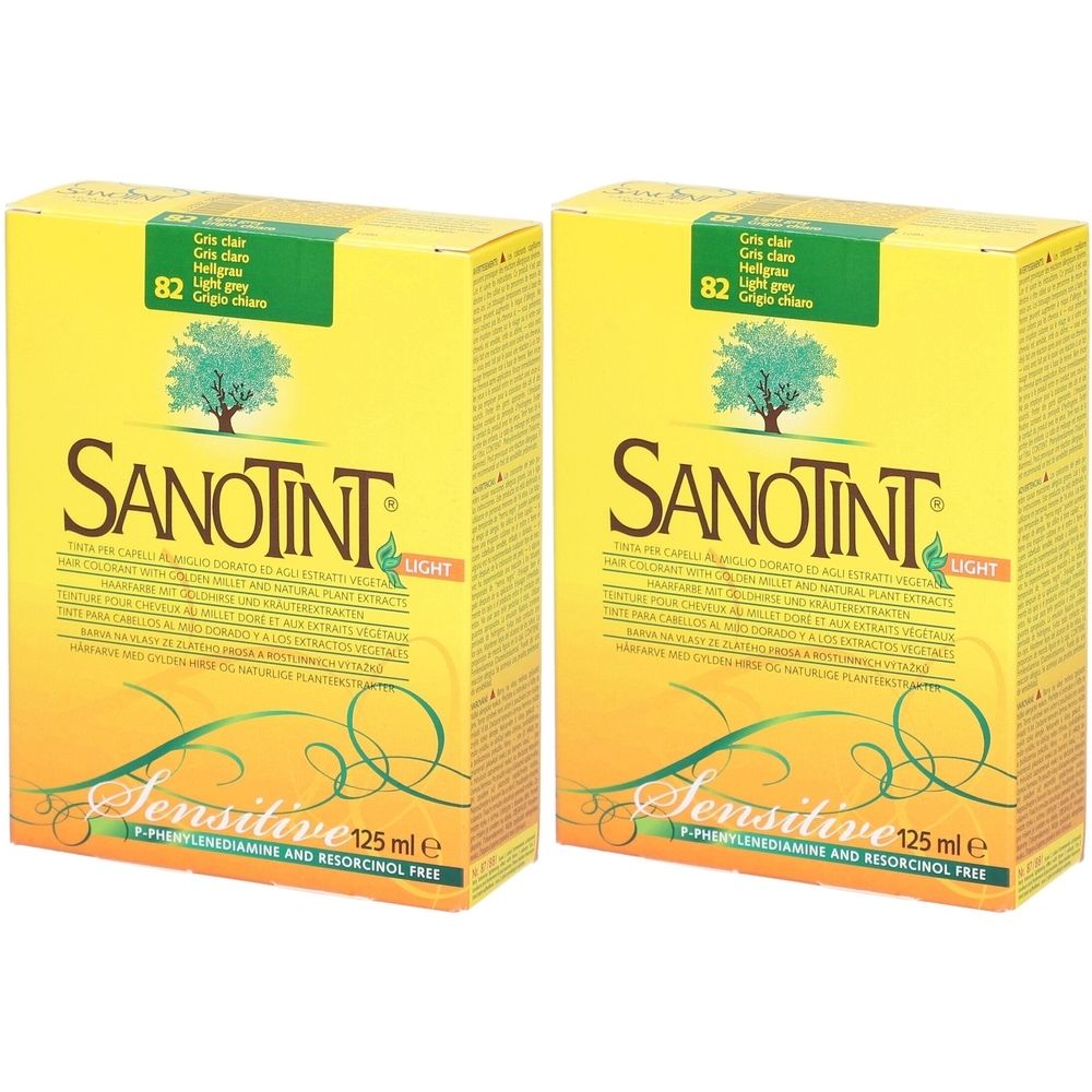 Zwei gelbe Kartons mit der Aufschrift SANOTINT LIGHT, Sensitive. Aufkleber mit Farbtonbezeichnung.