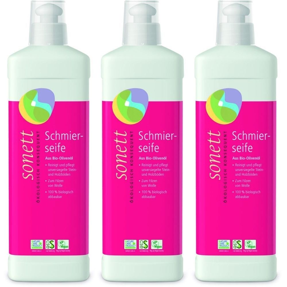 Drei Flaschen mit weißem Deckel und pinkfarbenem Etikett. Aufschrift: sonett Schmierseife. Mit Logo und Zertifizierungen.
