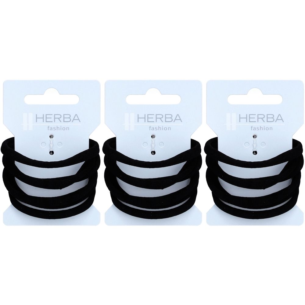 Drei schwarze Haargummis mit weißen Karten. Auf den Karten steht "HERBA fashion".